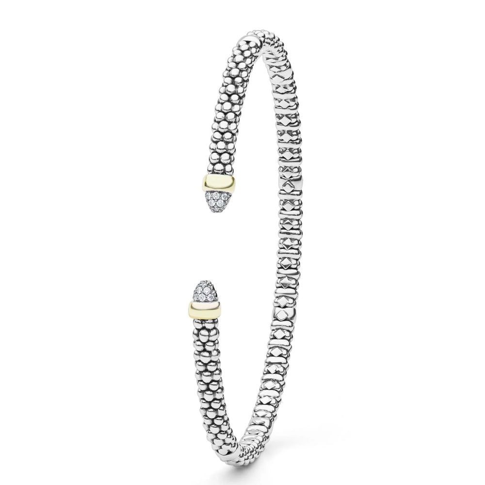 A  sterling silver textured  beaded cuff bracelet with two gold-toned end caps, each accented with diamond cabochons.
