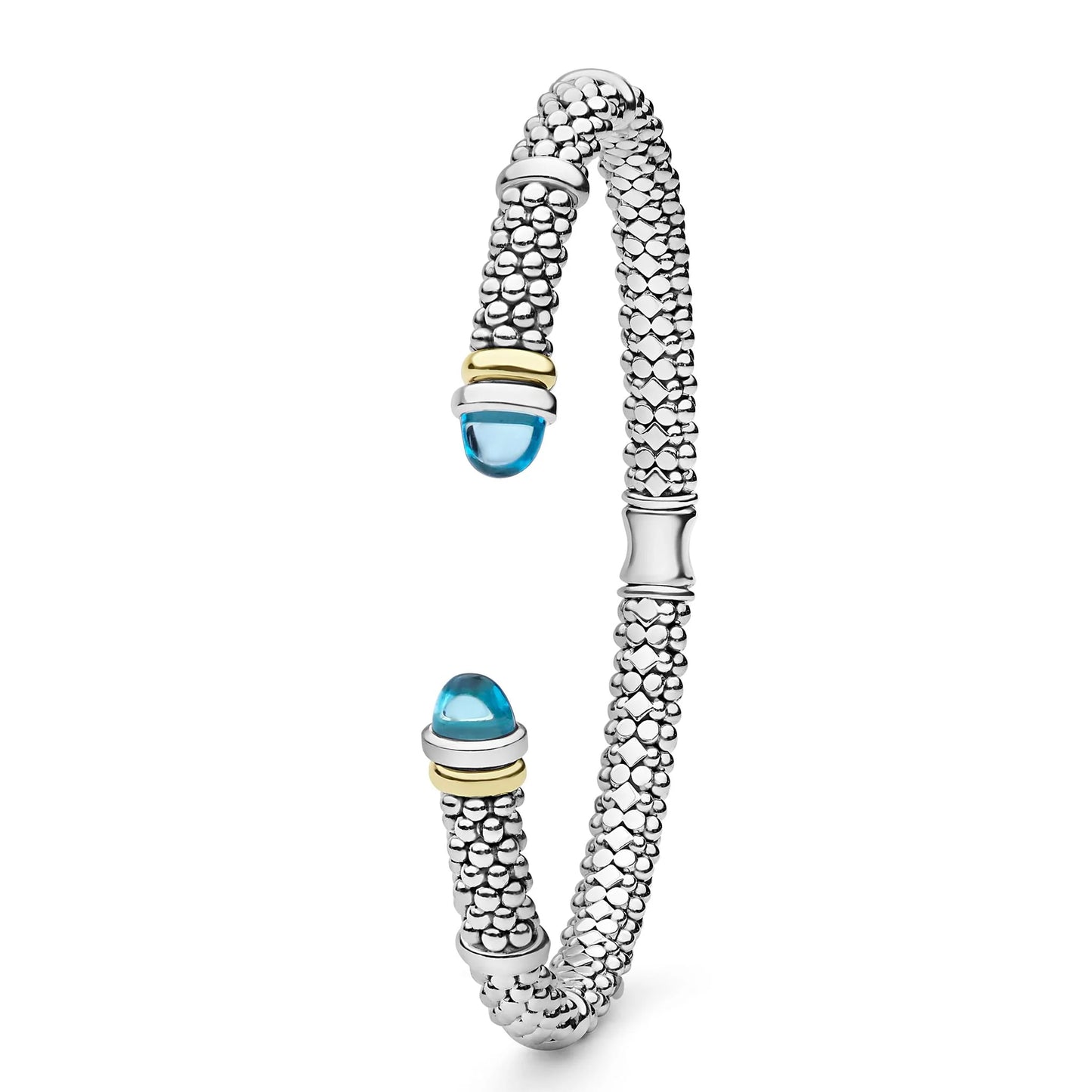 A silver-toned textured bangle bracelet with two blue cabochon gemstone accents and small gold-toned detailing, shown on a clean white background.