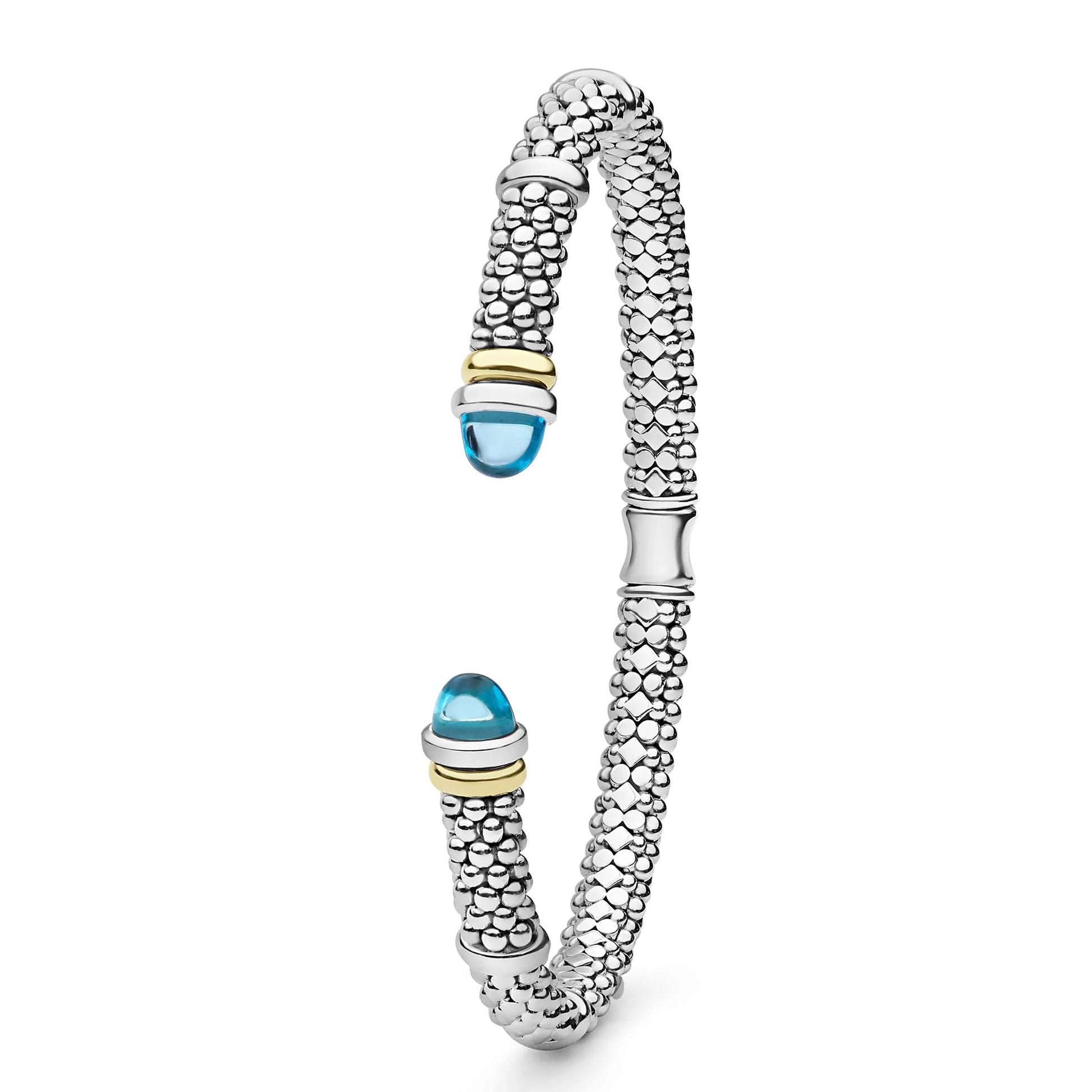 A silver-toned textured bangle bracelet with two blue cabochon gemstone accents and small gold-toned detailing, shown on a clean white background.