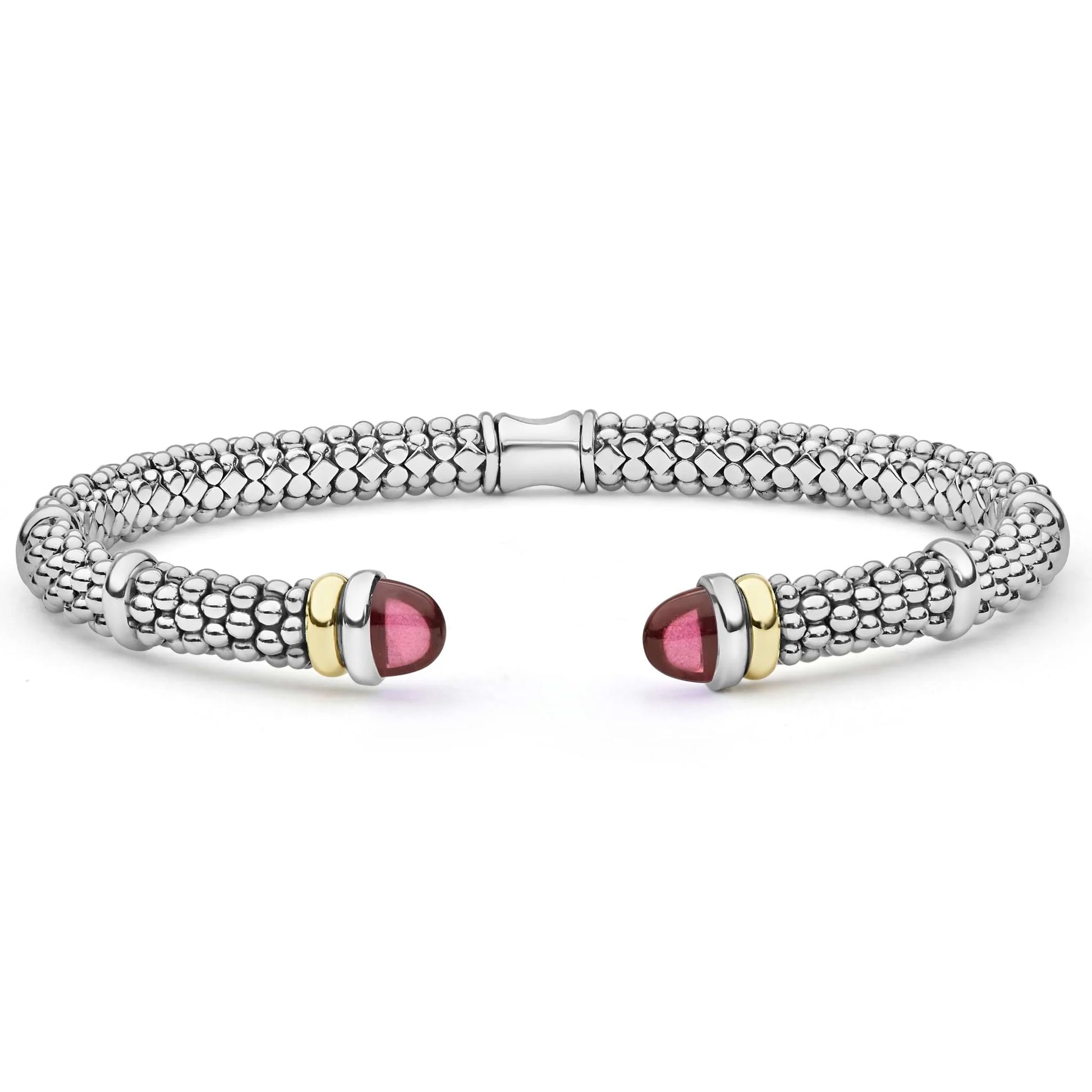 A silver-toned textured cuff bracelet with polished gold-toned accents and oval pink gemstone end caps, shown on a clean white background.