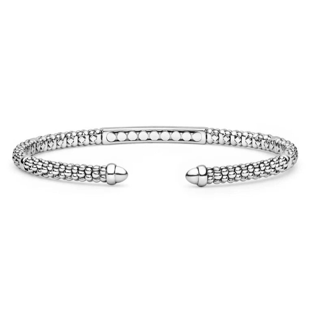 A Sterling silver open cuff bangle bracelet with a textured, beaded chain pattern and polished acorn-shaped end caps
