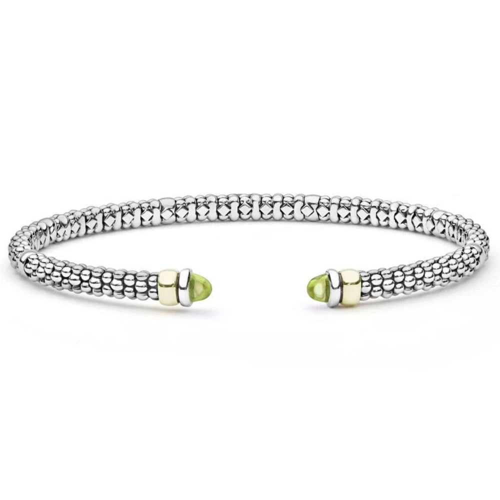 A Sterling silver textured beaded cuff bracelet with two gold-toned end caps, each featuring Peridot cabochons 