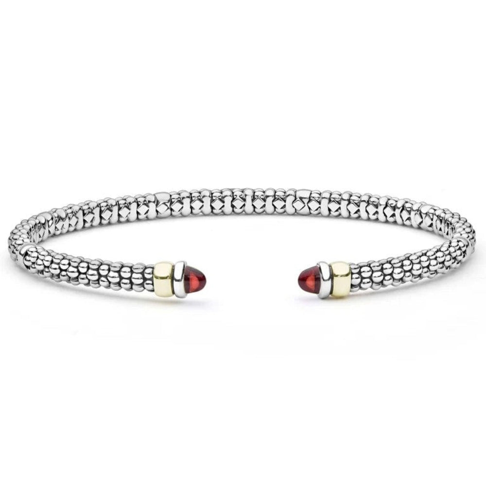 A Sterling silver beaded textured cuff bracelet with two gold-toned end stations and red Garnet end cabochons 