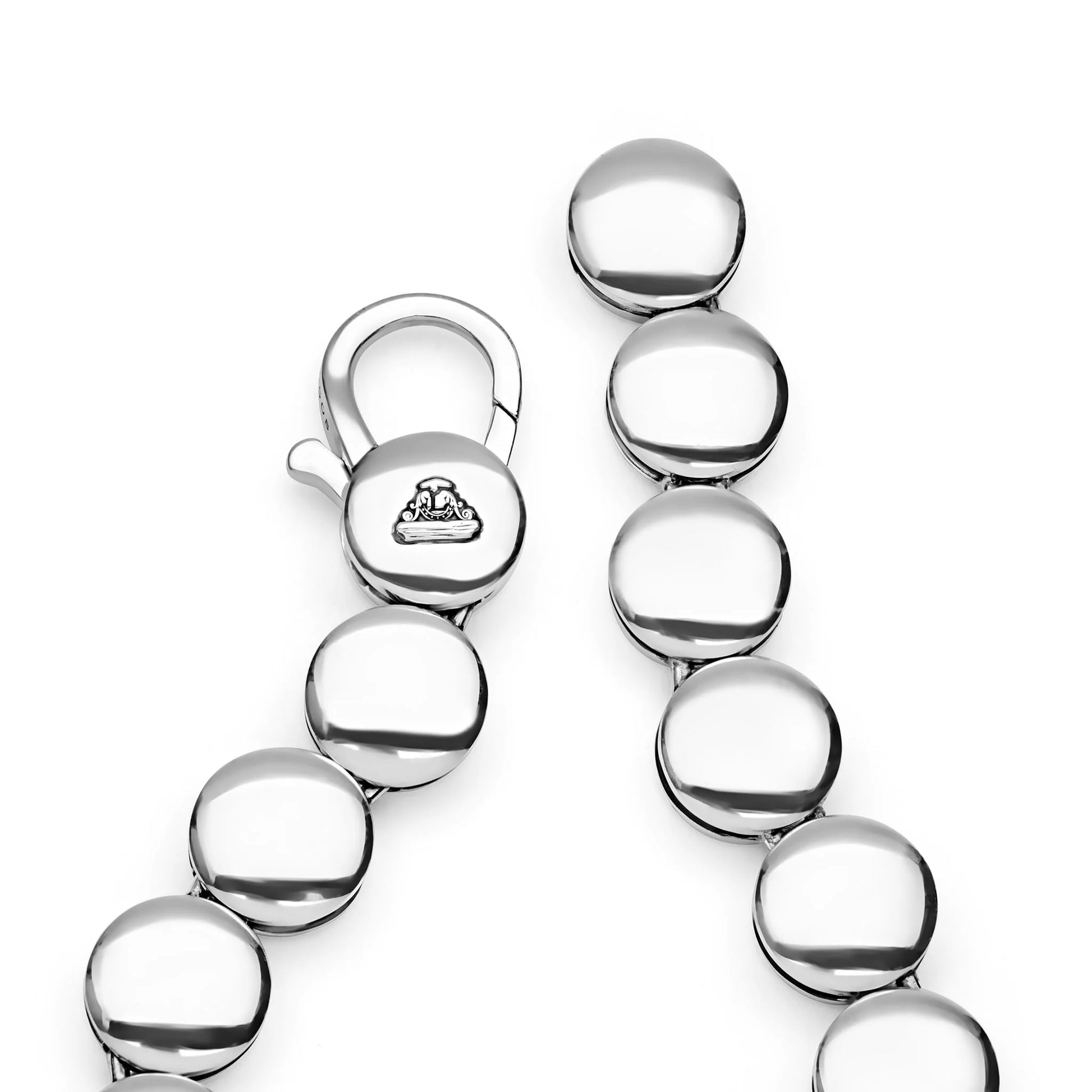 A close-up of a polished silver-toned beaded bracelet or chain with a lobster clasp, shown on a clean white background. The clasp is engraved with a small logo.
