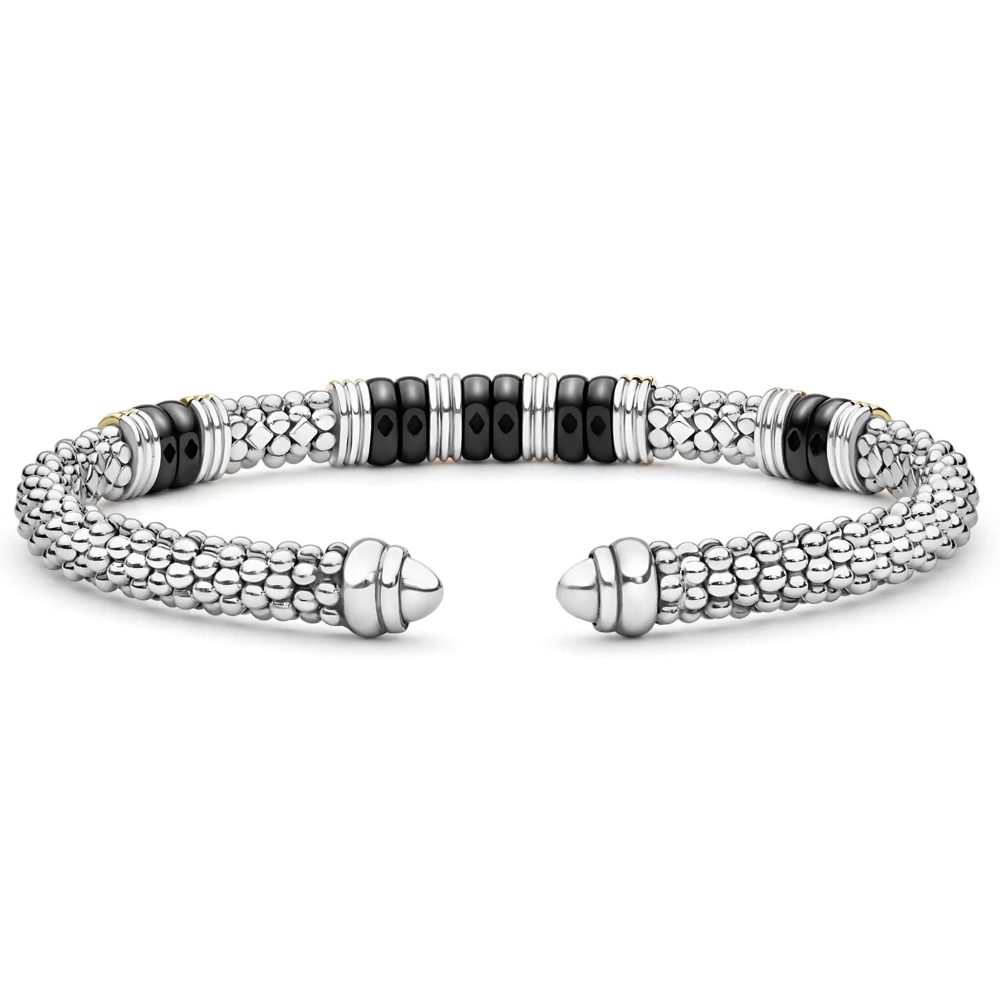 A silver-toned cuff bracelet with textured beaded segments, polished accent beads, and a row of glossy black round beads, displayed on a clean white background.