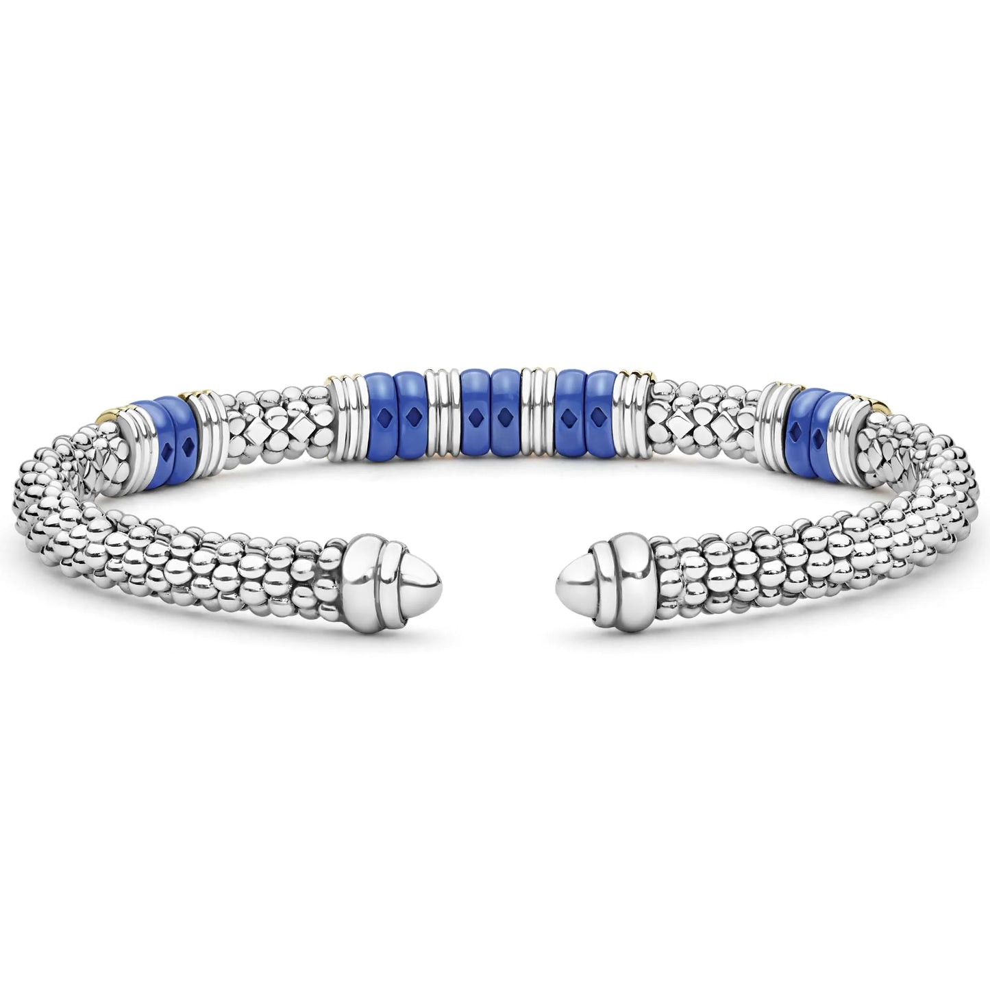 A silver-toned beaded cuff bracelet with alternating textured silver links and smooth royal blue cylindrical beads, shown on a plain white background.