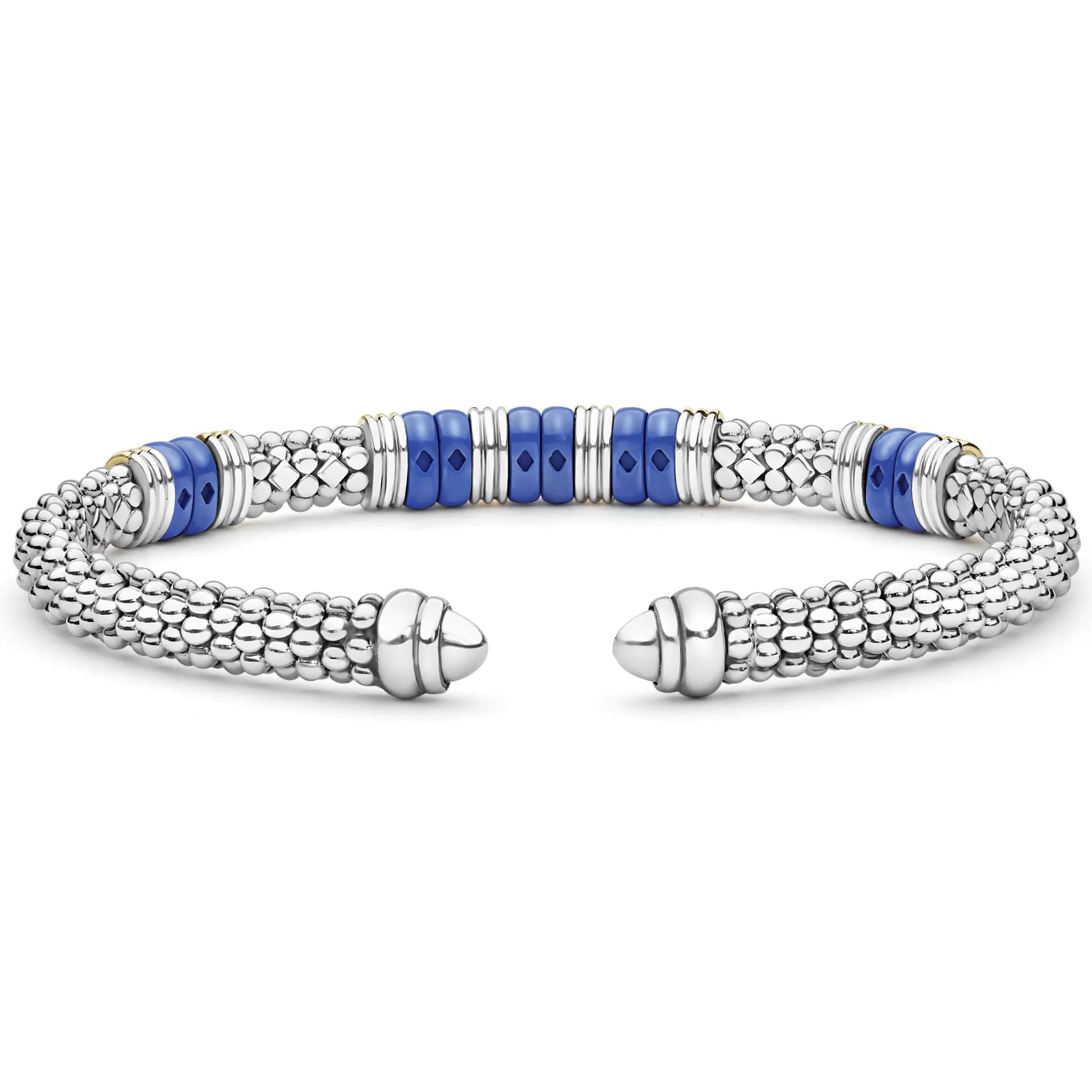 A silver-toned beaded cuff bracelet with alternating textured silver links and smooth royal blue cylindrical beads, shown on a plain white background.