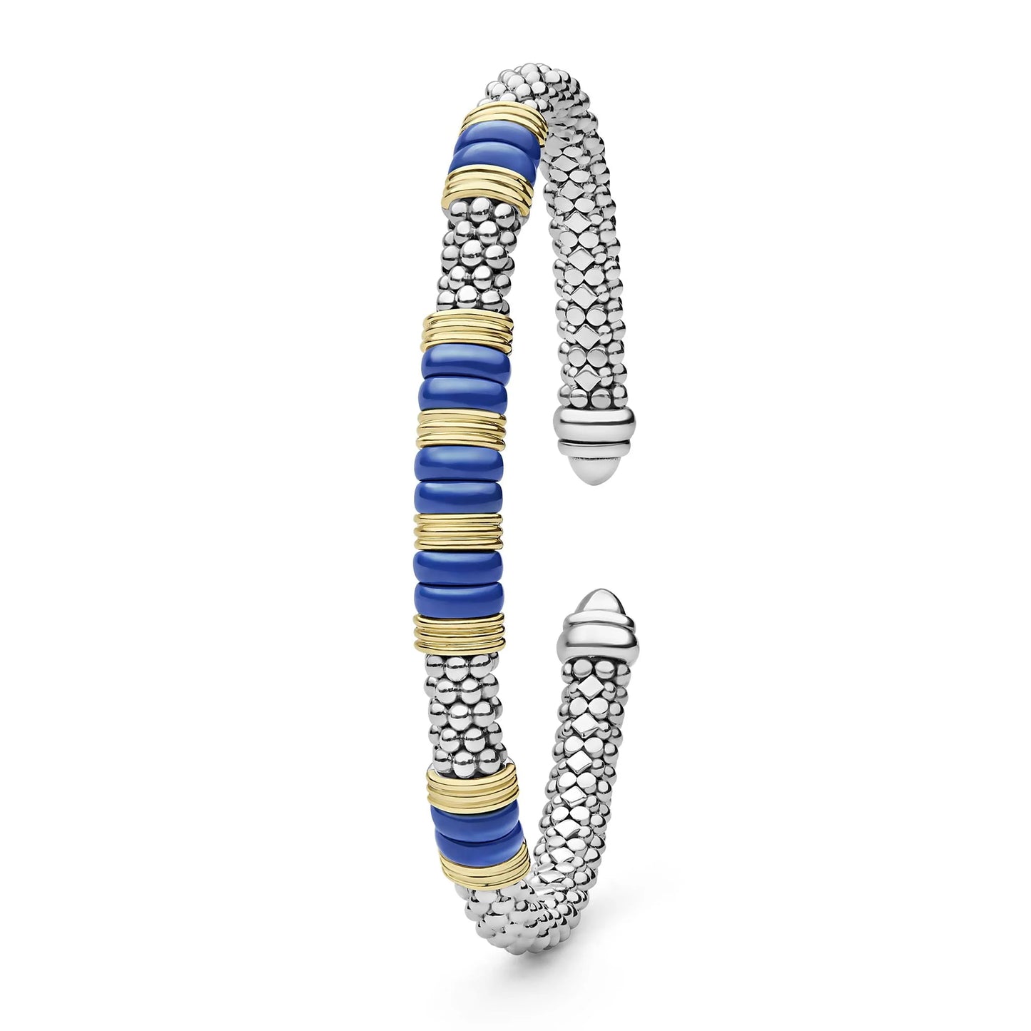 A silver-toned textured cuff bracelet with a central column of round blue beads accented by gold-toned spacers, shown on a plain white background.