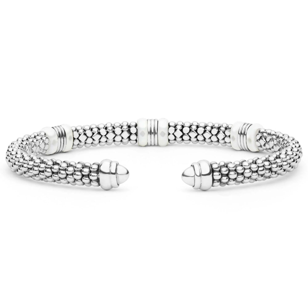 A silver-toned textured cuff bracelet with a beaded, woven appearance and polished end caps, shown on a plain white background.