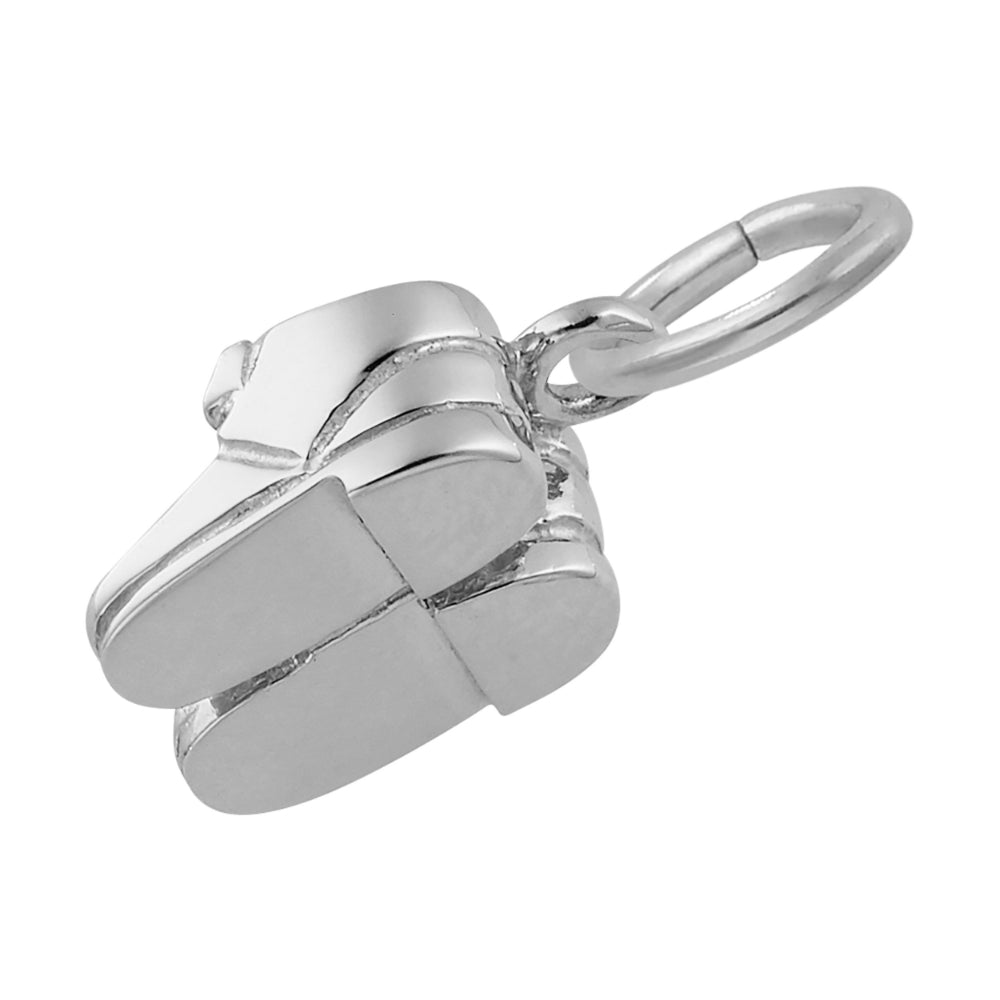 Silver baby shoe charm on a white 
background bottom view