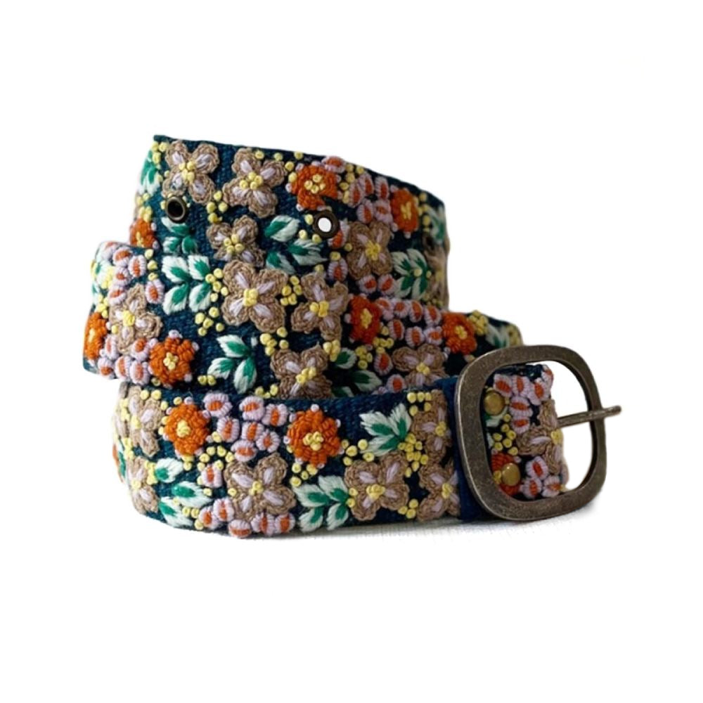 A floral embroidered wool belt with a metal buckle, featuring a multicolored pattern.
