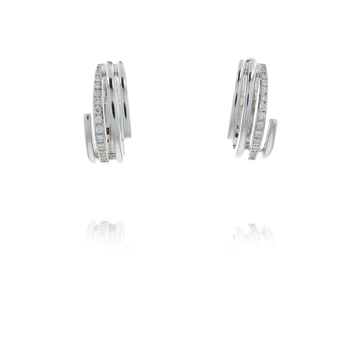 A pair of white gold wrap-around hoop earrings with rows of small clear stones, displayed on a clean white background with a soft reflection below.