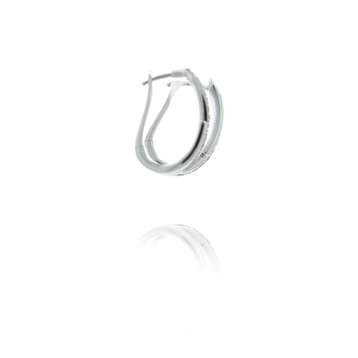 A pair of polished white gold hoop earrings with a textured outer band, shown on a clean white background with a soft reflection below.