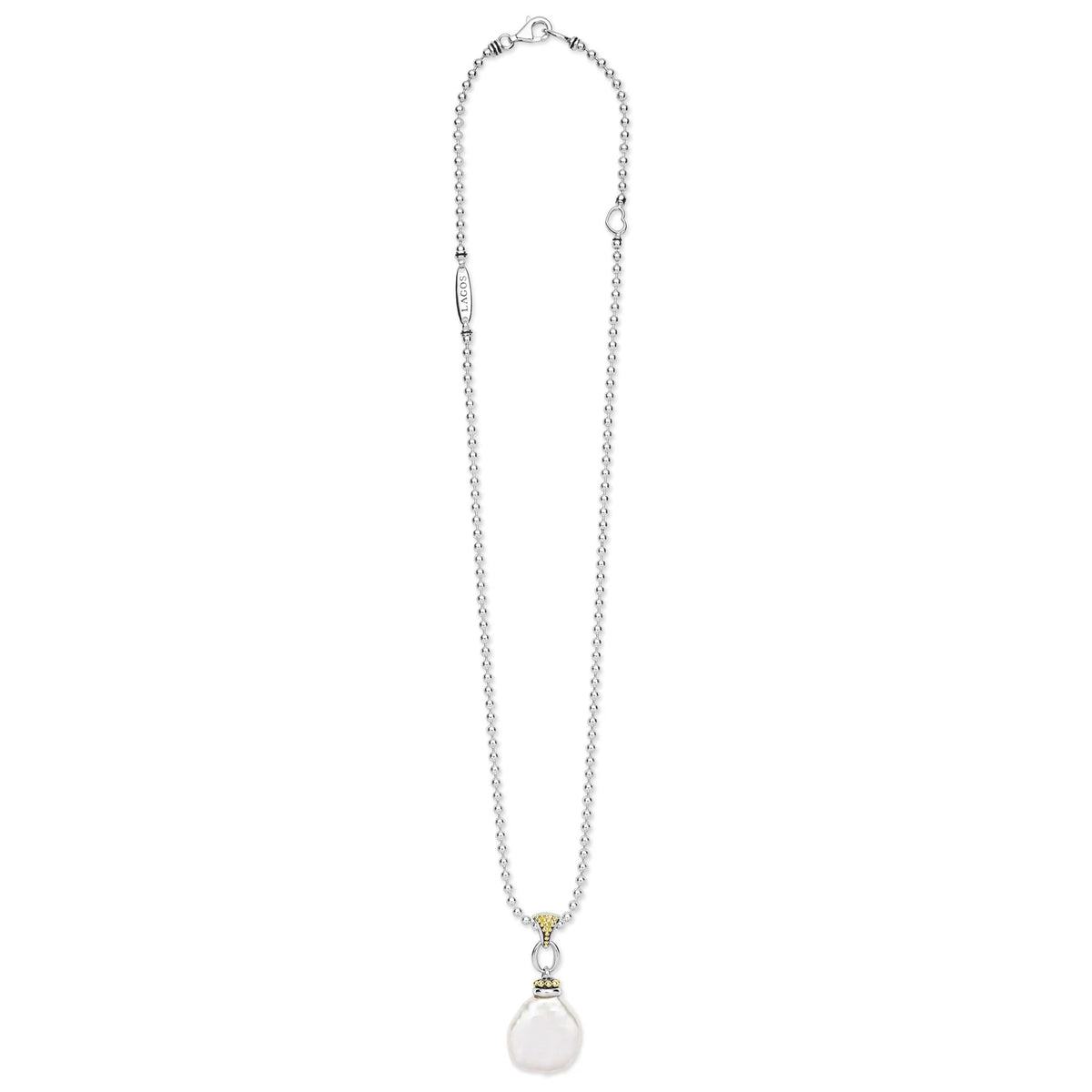 A silver-toned chain necklace featuring a small gold ring accent and a round, milky white pendant, displayed against a solid white background.