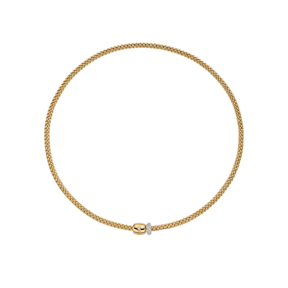 A delicate gold chain necklace with a small central connector featuring a tiny clear stone, displayed on a solid white background.