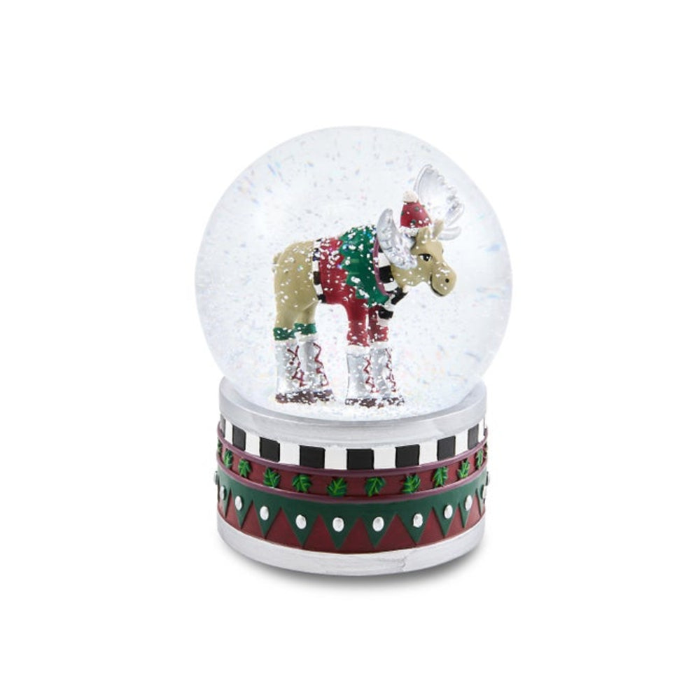 A festive moose snow globe decoration featuring a moose wearing a red Santa hat and green holiday sweater, set inside a clear glass globe on a patterned red, green, and white base.