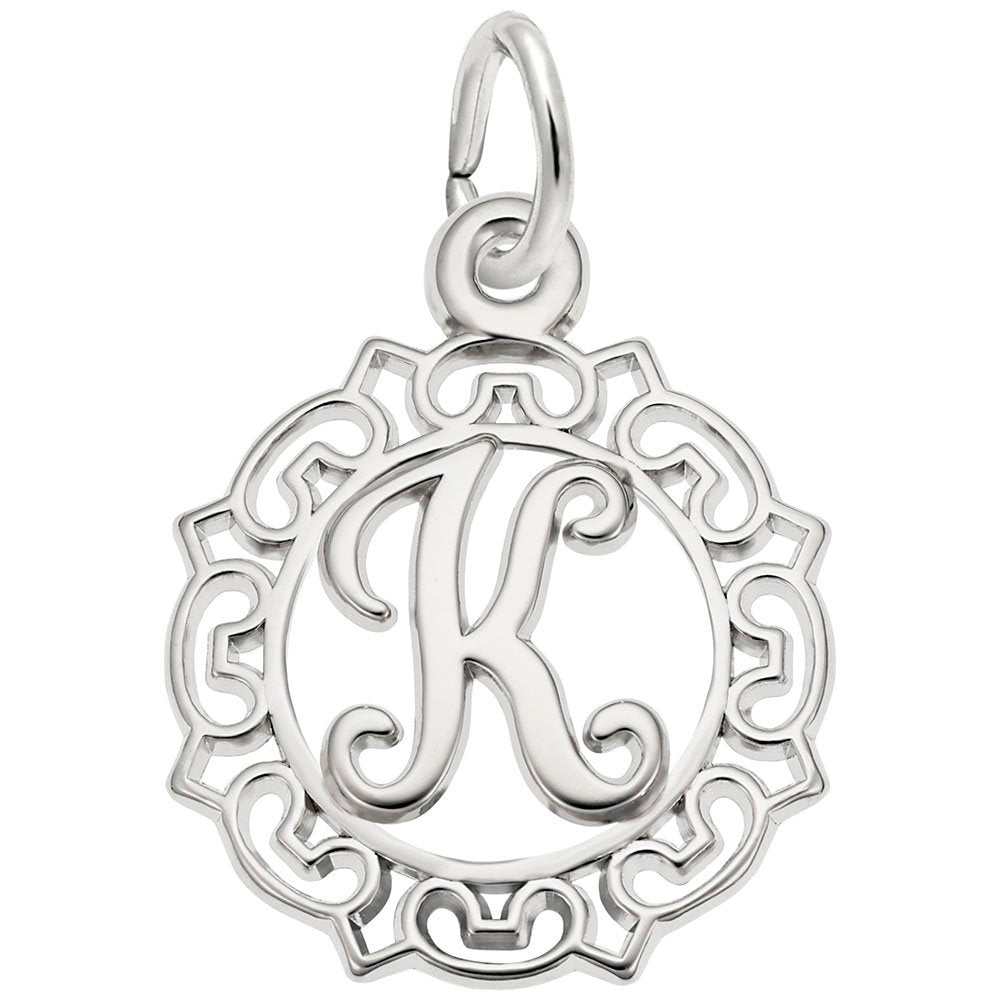 Silver K in an ornate boarder charm on a white background 