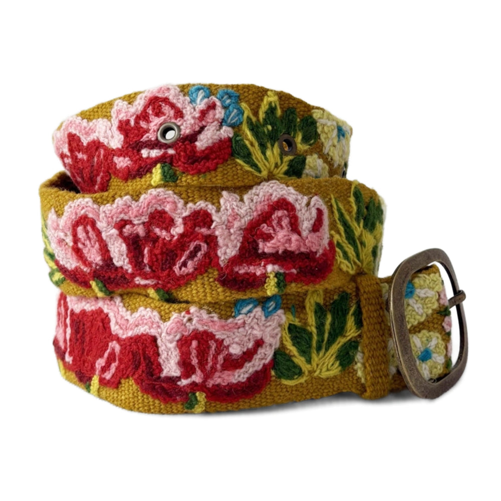 Floral patterned belt with a metal buckle on a white background