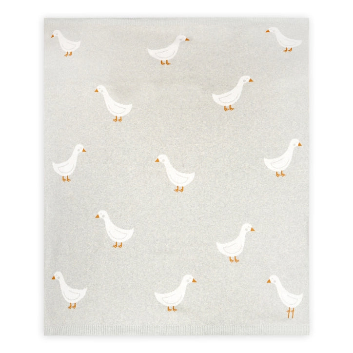 Pattern of white ducks on a textured gray blanket 