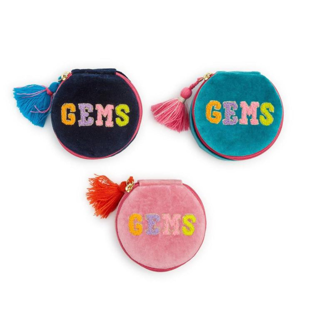 Three round velvet coin pouches with tassel zipper pulls, each embroidered with the word 'GEMS' in multicolored letters. The pouches are navy blue with a blue tassel, teal with a pink tassel, and pink with an orange tassel, shown on a white background.
