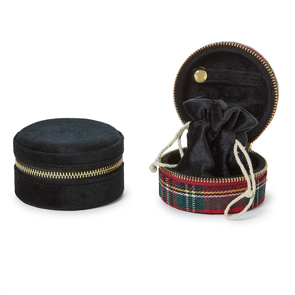 Red plaid jewelry box with a black velvet interior and drawstring bag with gold zipper next to a black velvet jewelry box on a white background