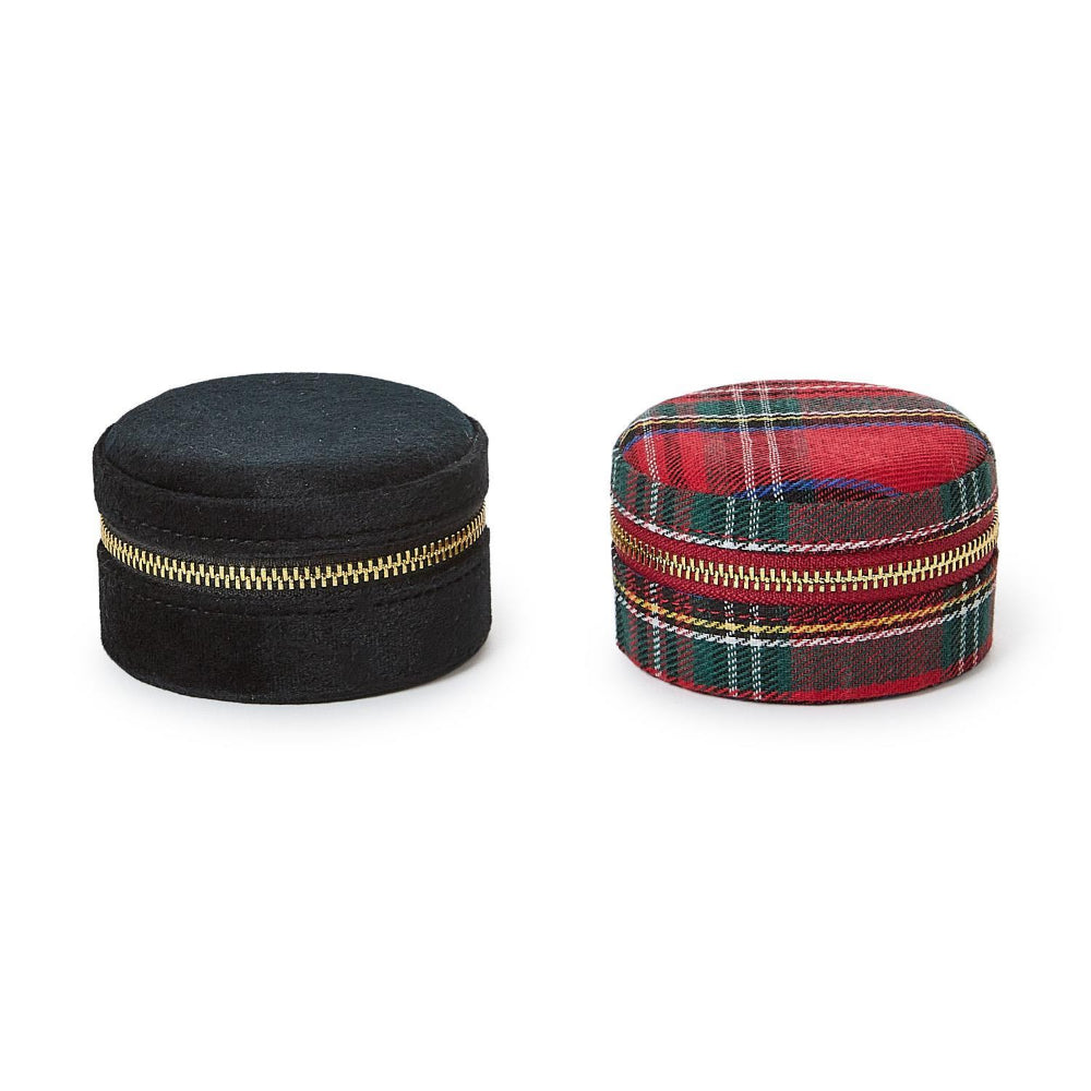 Black and red plaid velvet jewelry boxes with gold zippers a white background.