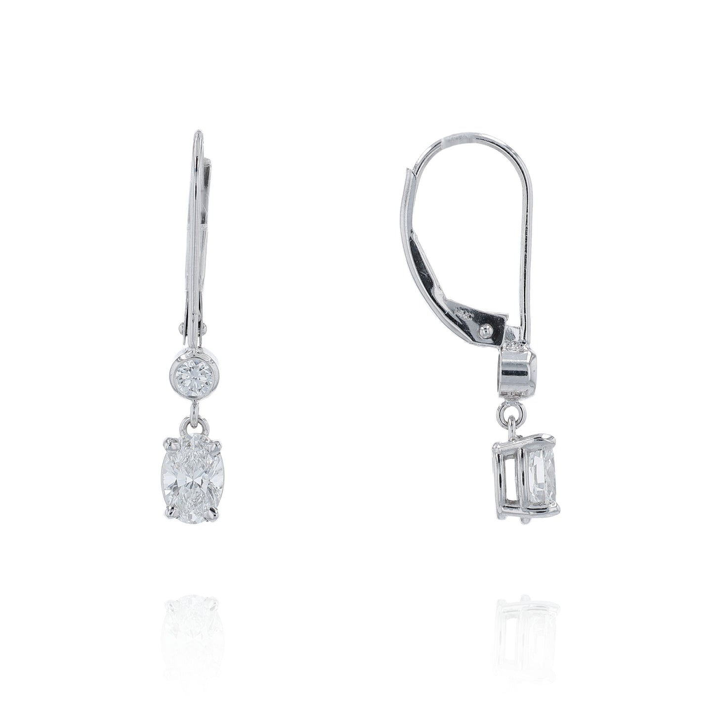 White gold round and oval diamond drop earrings on a white background