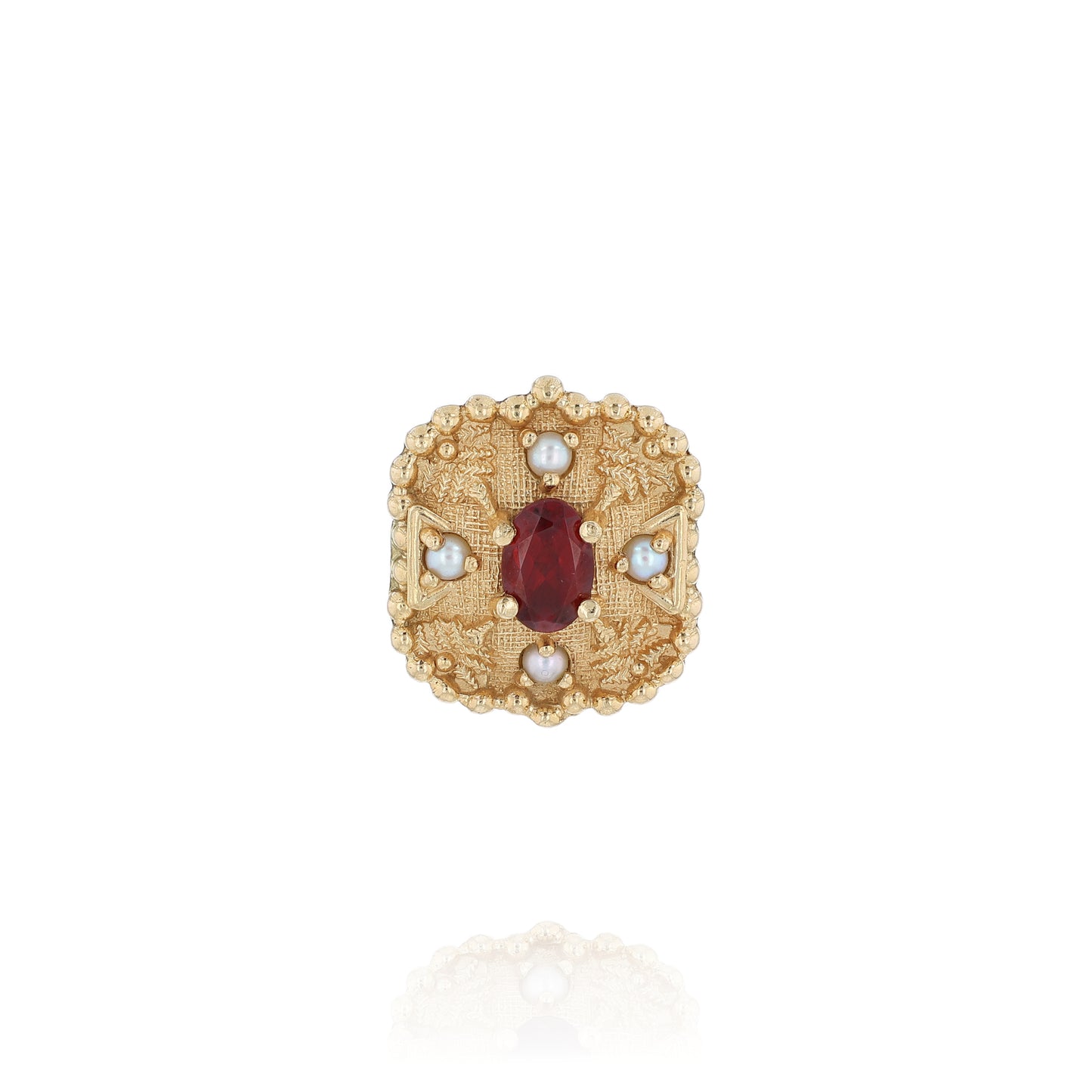 Yellow gold slide pendant with an oval garnet center and surrounding pearls on a white background