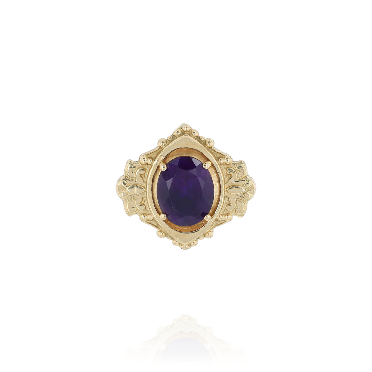 Yellow gold oval amethyst slide pendant with an ornate shield shaped frame on a white background