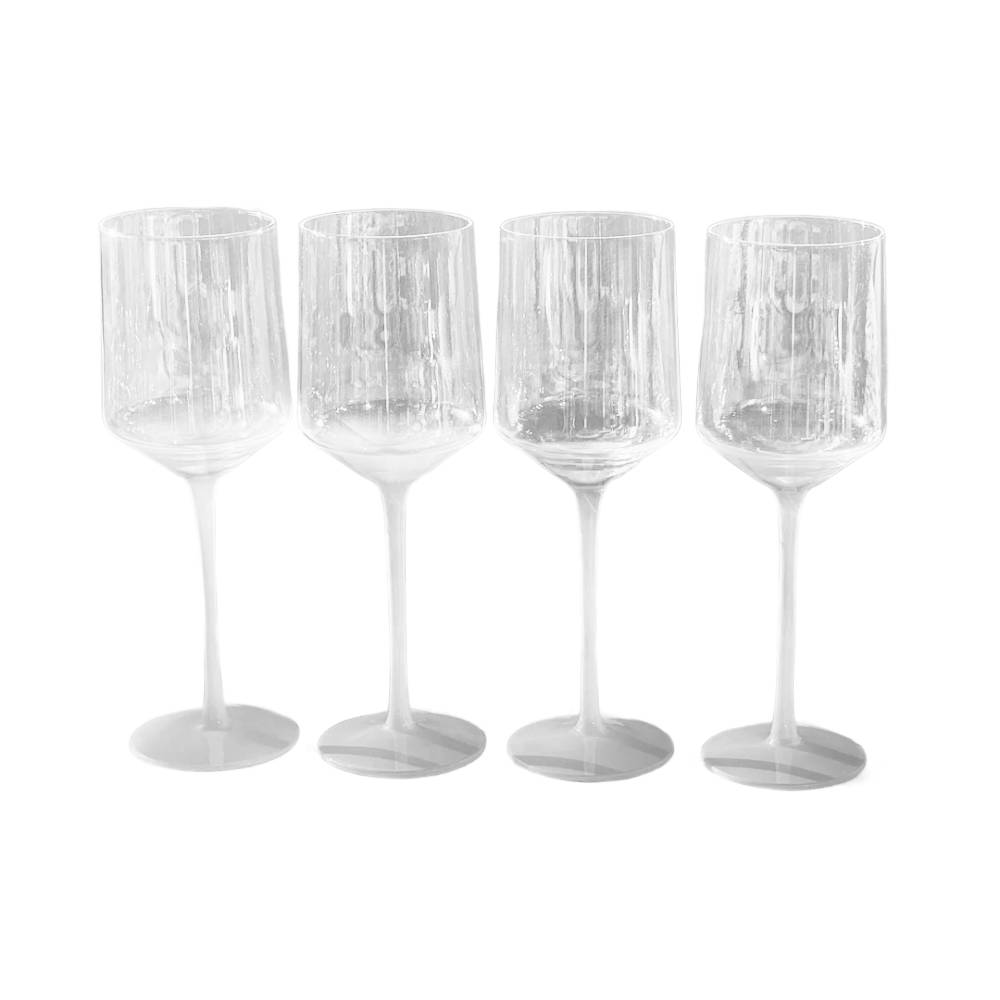 Four clear glass wine glasses with a textured, vertically ribbed design and slender stems, arranged in a row against a plain white background.