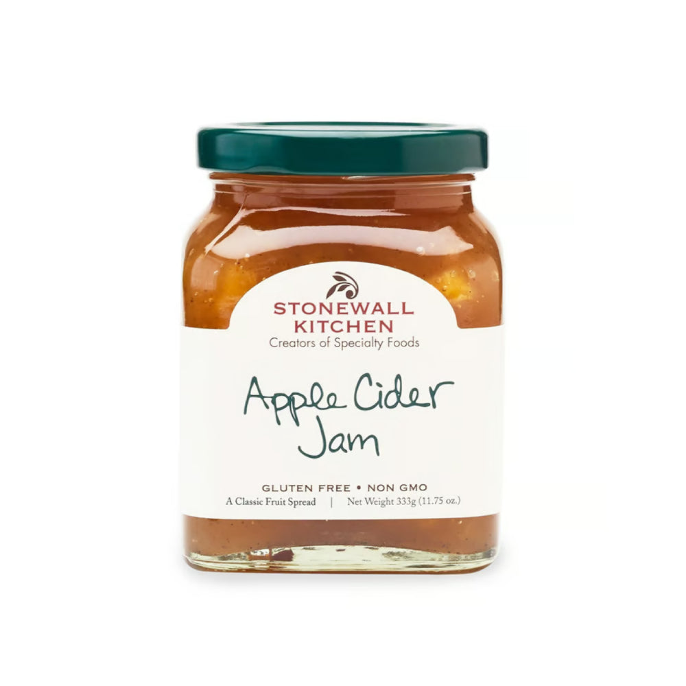 A glass jar of Stonewall Kitchen Apple Cider Jam with a dark green lid and a white label, set against a plain white background.