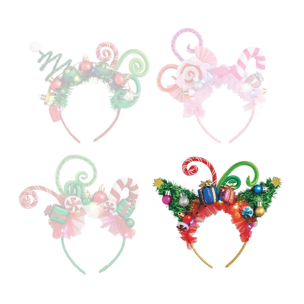Blue festive headband with candy cane designs and christmas ornaments on a white background.