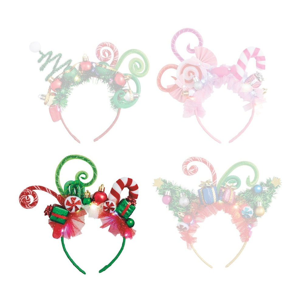 Green festive headband with candy cane designs and christmas ornaments on a white background.