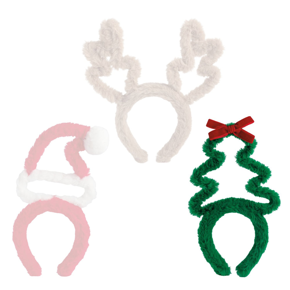 Green festive tree headband with red red bow on top on a white backround. 