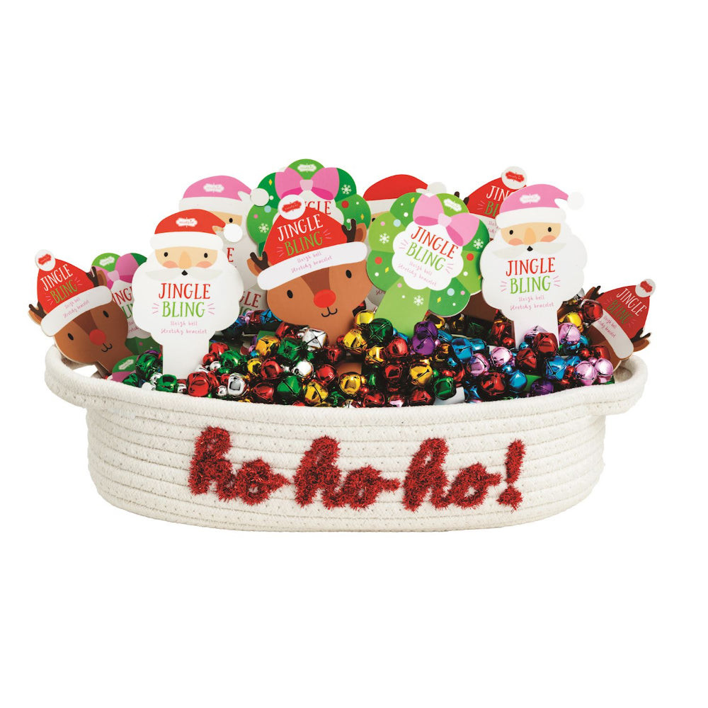 Decorative basket filled with colorful Christmas jingle bell bracelets and on a white background.