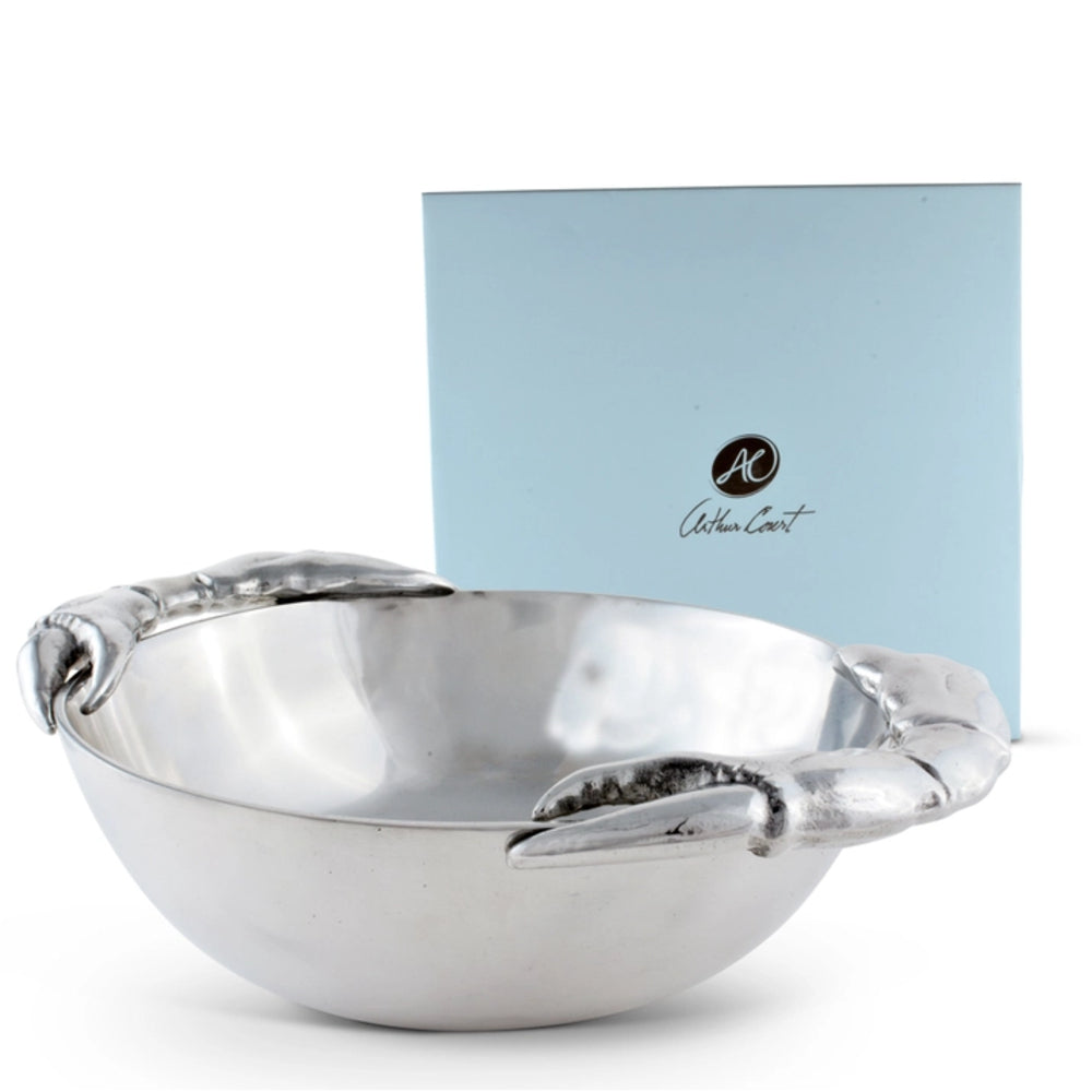 A polished silver bowl with sculpted lobster claw handles, shown in front of a light blue presentation box featuring the Golden Locket brand logo.