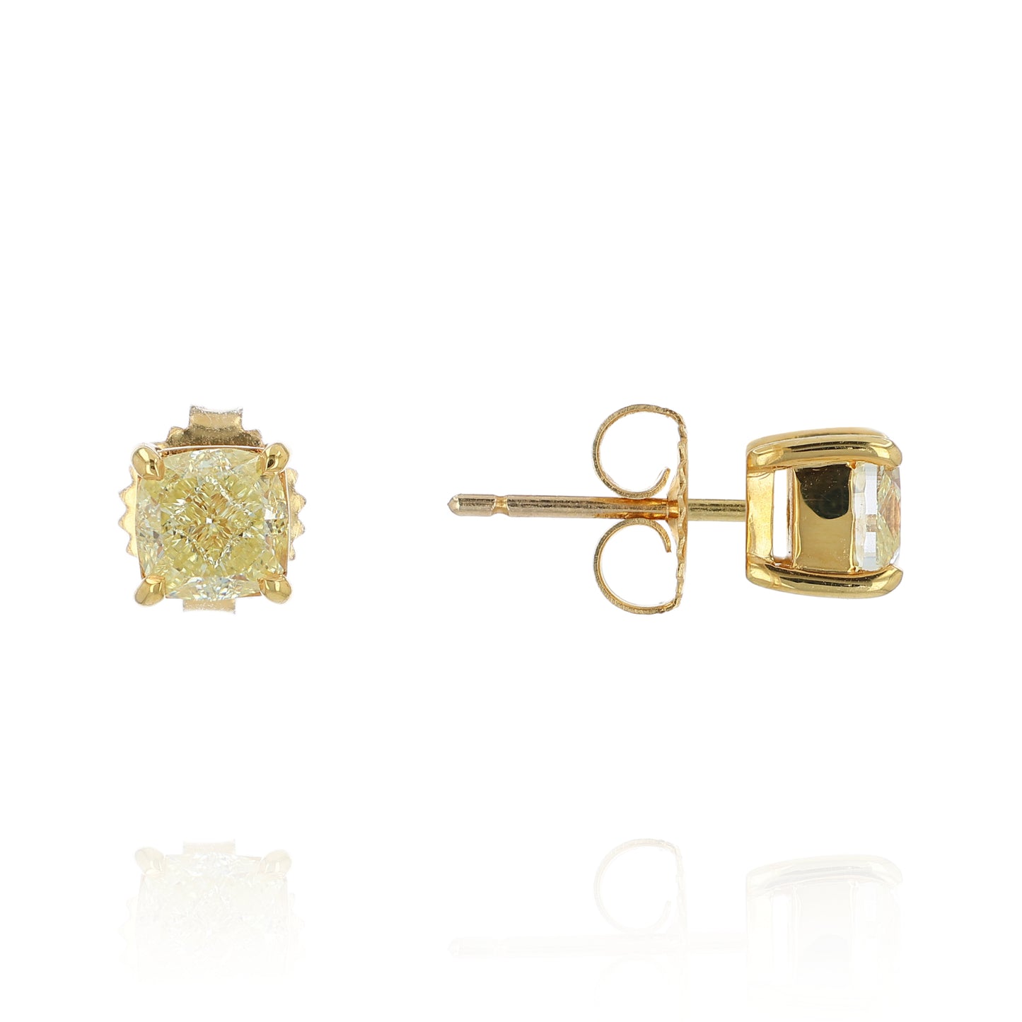 A pair of yellow gold stud earrings with cushion-cut fancy yellow diamonds, shown from the front and side on a white background with a soft reflection.