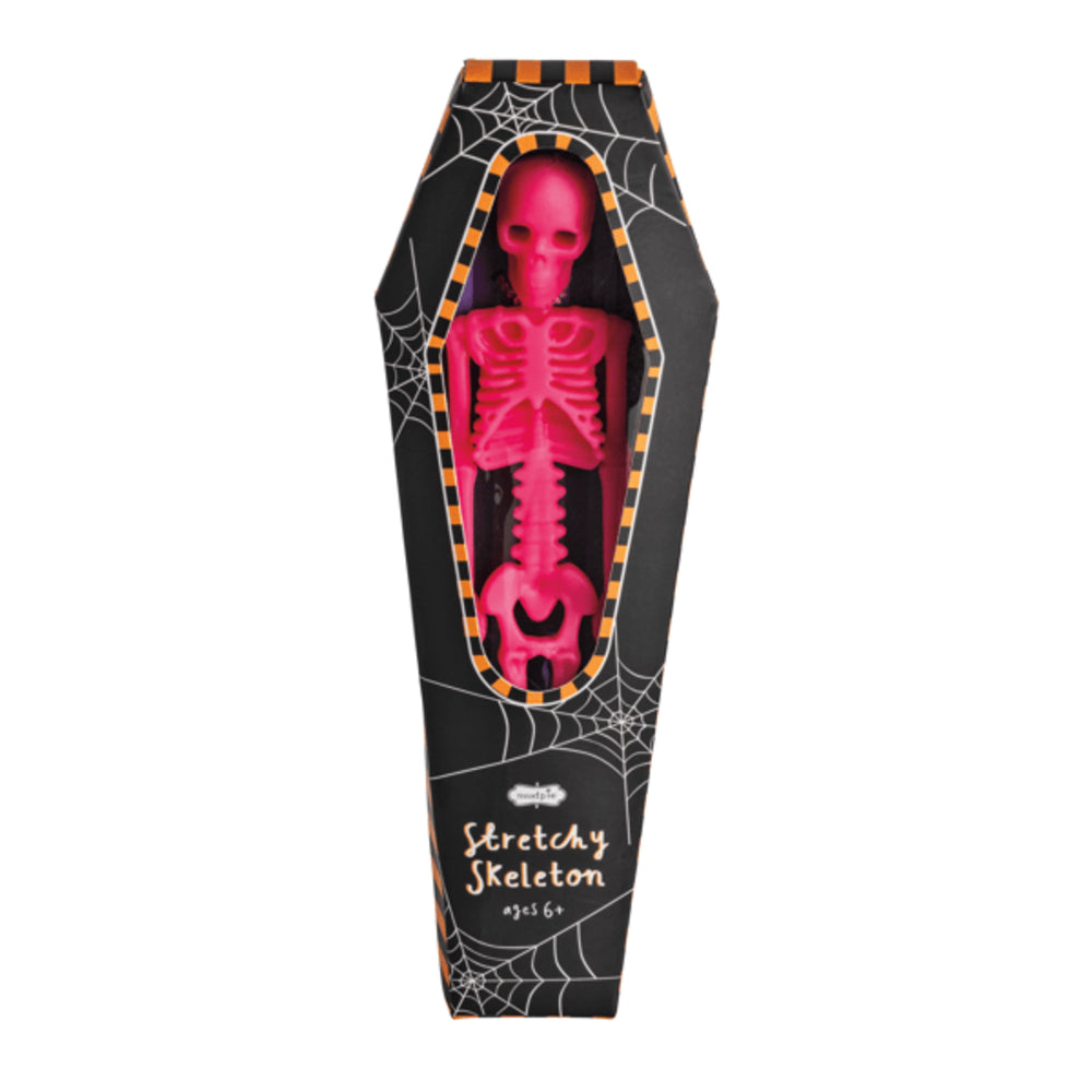 Pink skeleton toy in a black coffin-shaped box with spider web design on a white background