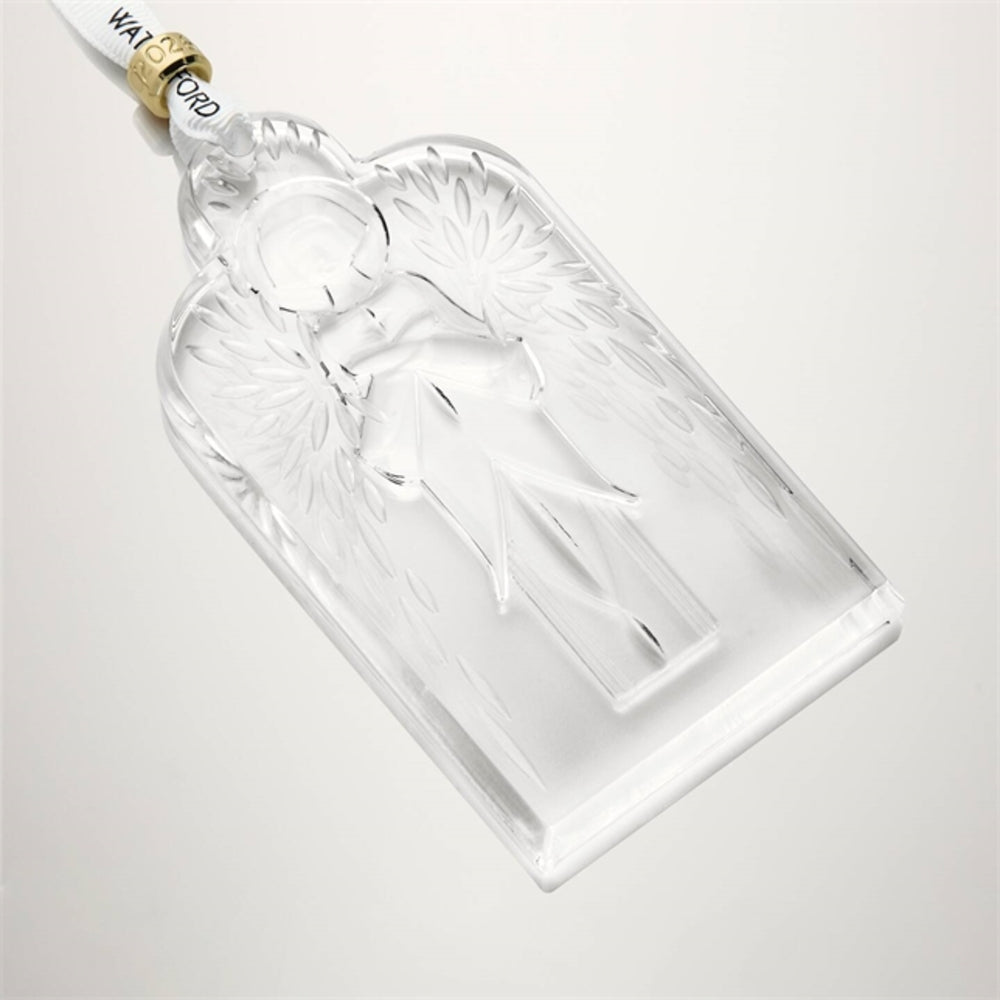 Clear glass angel ornament with gold and white accents on a light gray background