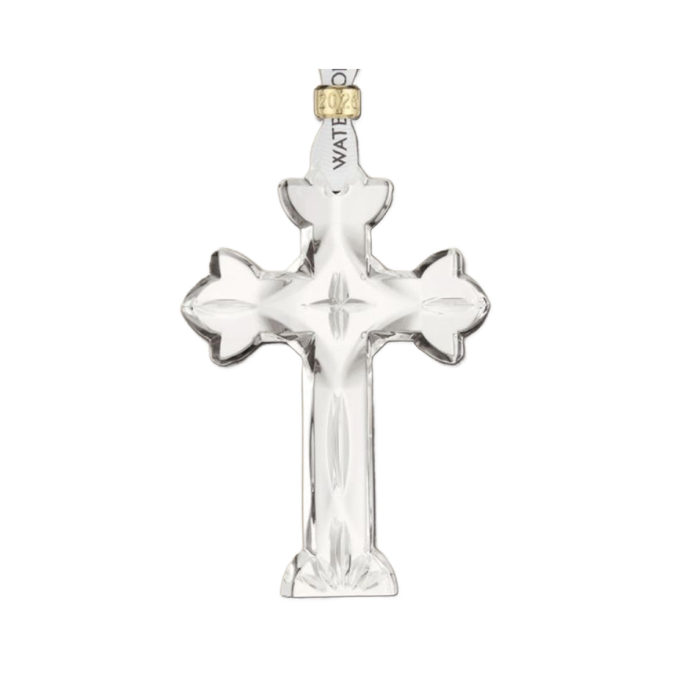2026 Waterford Cross crystal christmas ornament with gold cuff on the hanger that says "2026" engraved in it on a white backround.
