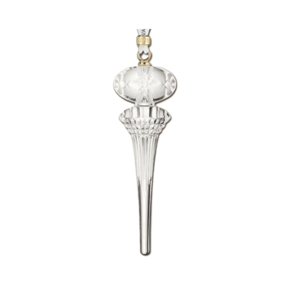 2026 Waterford Icicle clear glass chrismas ornament with a gold cuff on the hanger with "2026 engraved on it on a with backround 