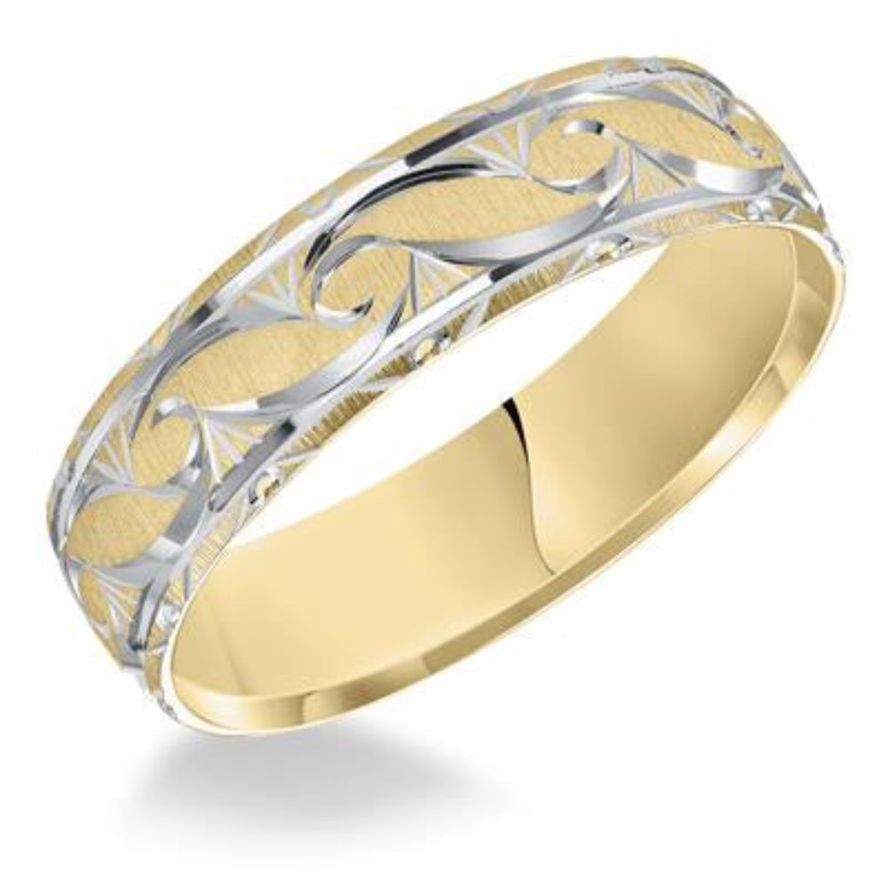 Gold and silver ring with intricate design on a white background