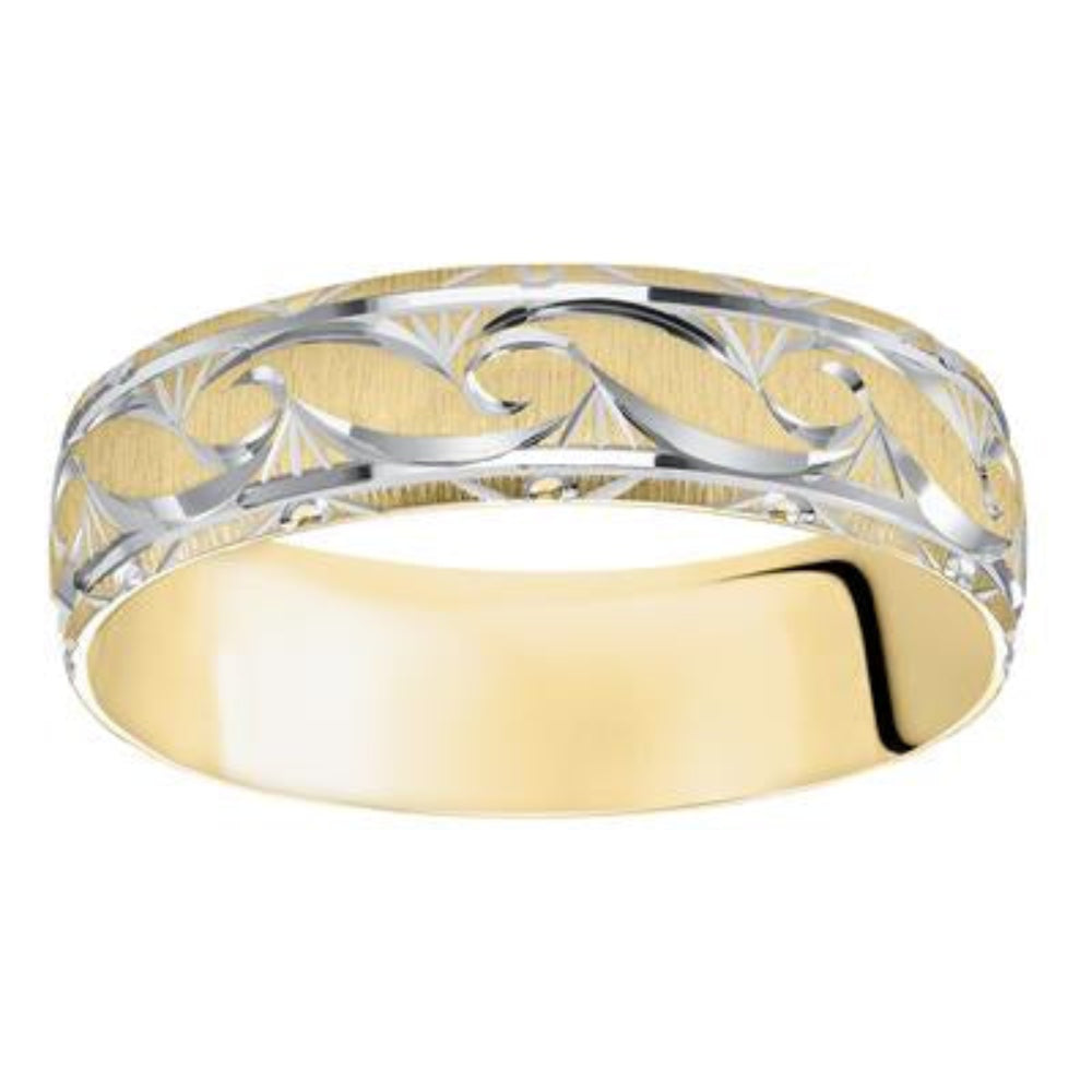 Two-tone gold ring with intricate design on a white background