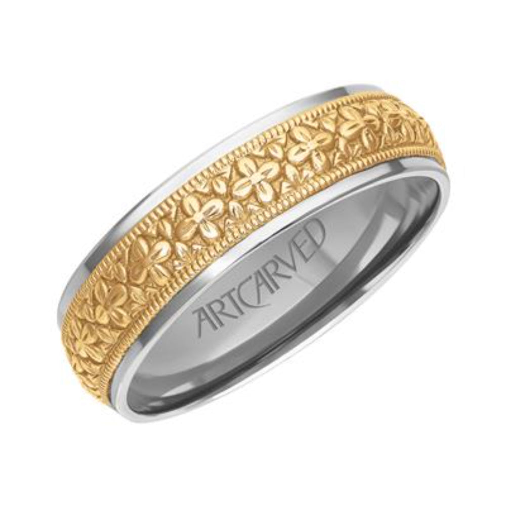 Two-tone ring with intricate design and 'ArtCarved' branding on a white background