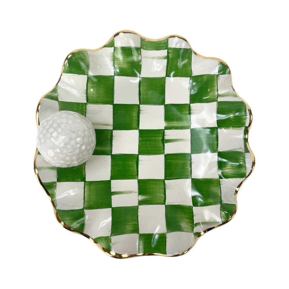 A Green and white check MacKenzie Childs ceramic golf ball wavy plate on a white background