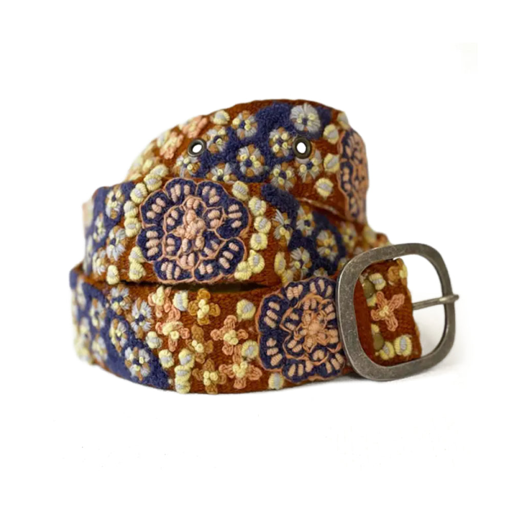 Floral patterned belt with a metal buckle on a white background