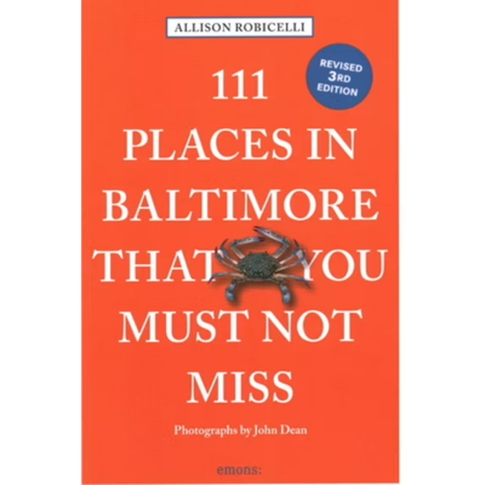 Book cover of 111 Places In Baltimore That You Must Not Miss with crab logo on it on orange book cover background. 