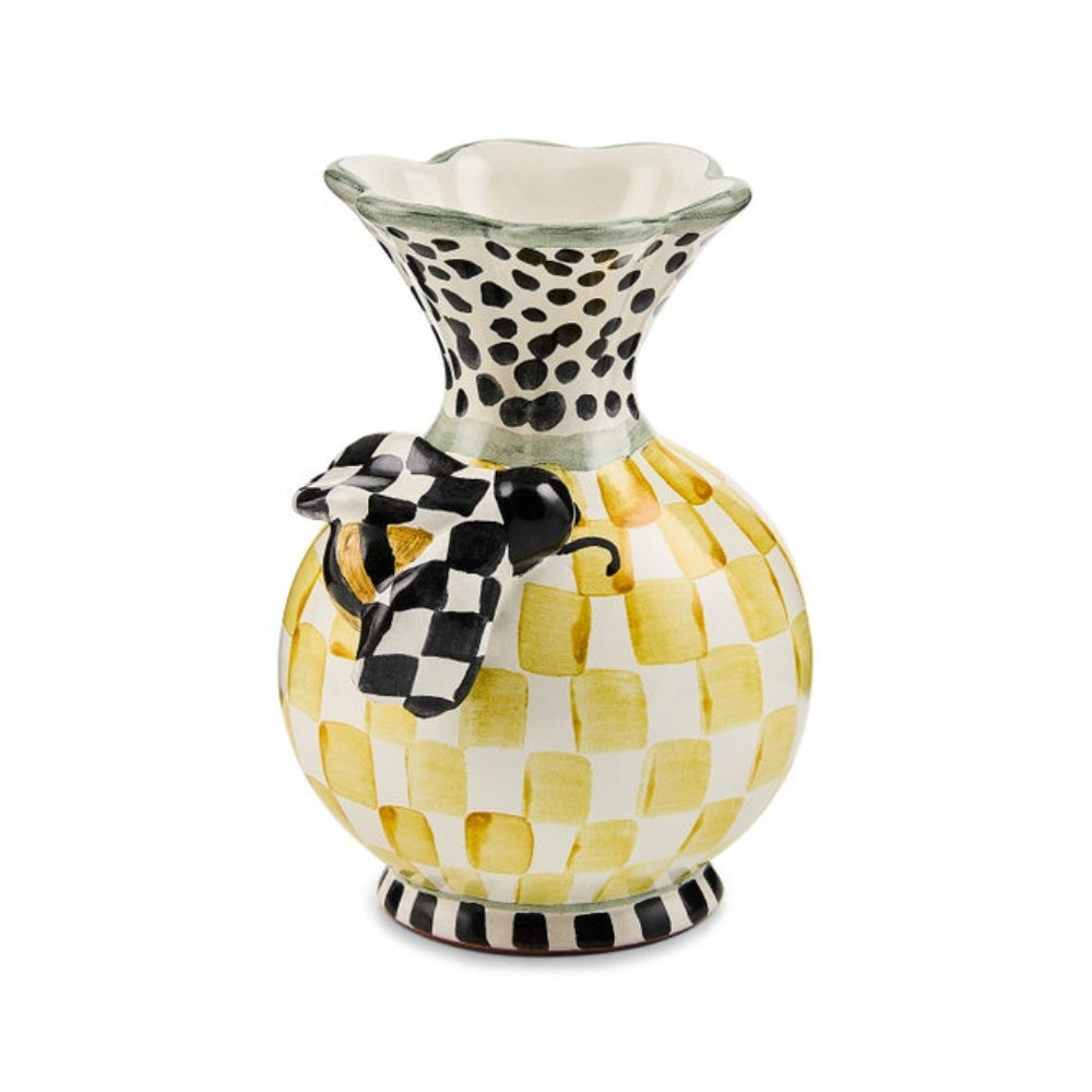 A colorful white, black, green  & yellow bee vase with a bee on the front on a white backround.