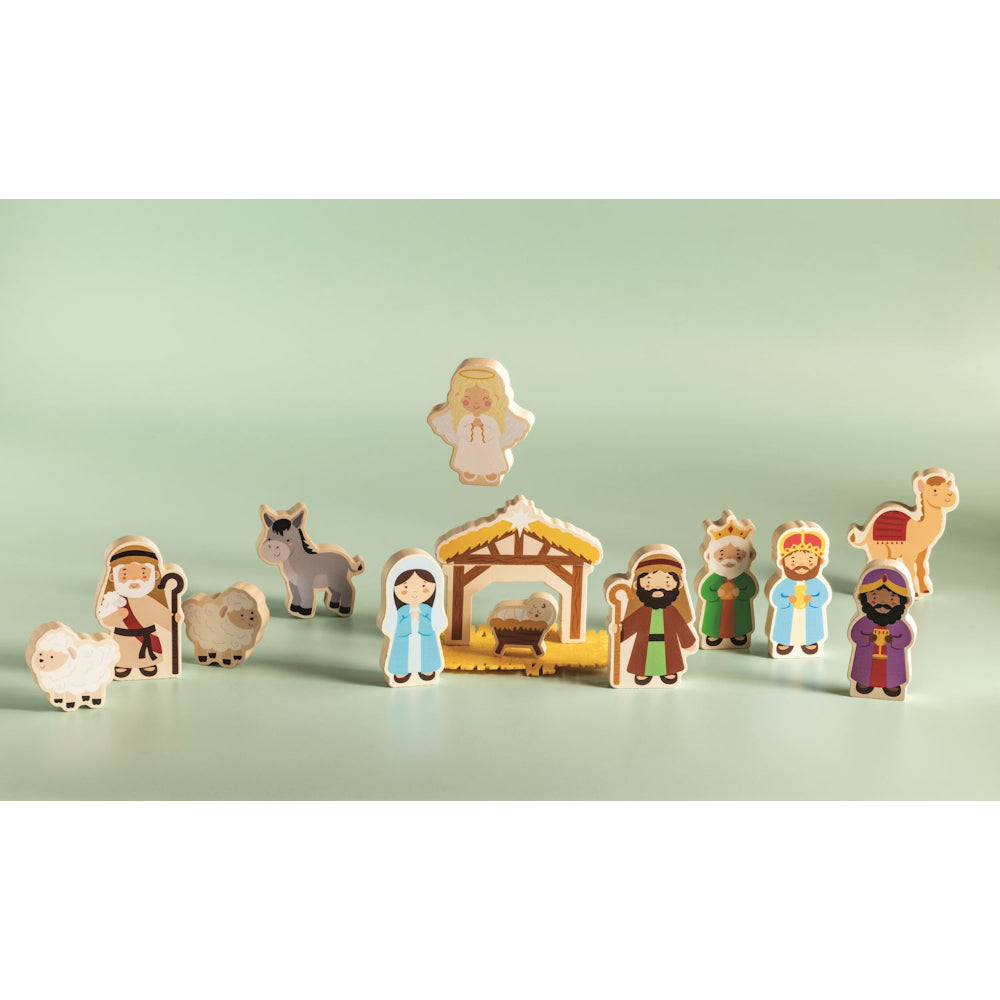 Nativity wooded play set, set out on a green backround. 