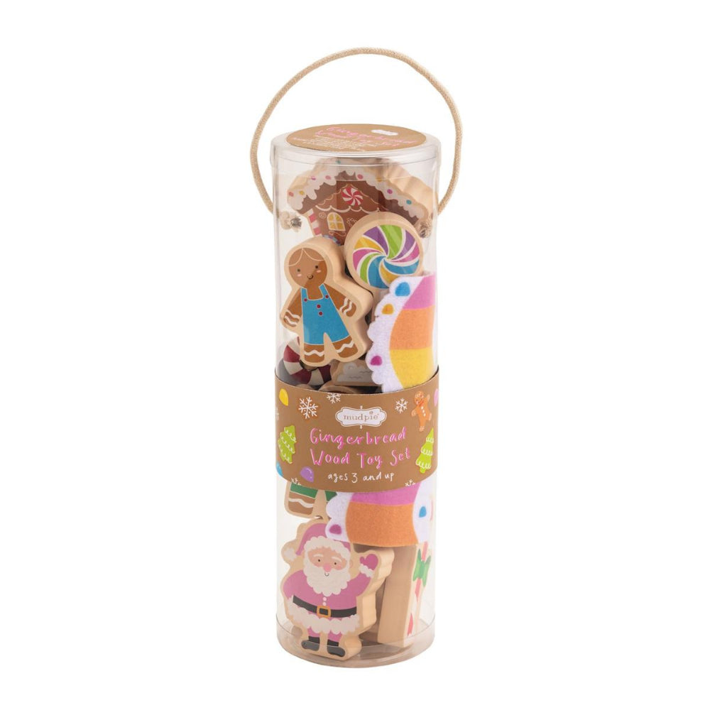 Set of gingerbread-themed wooden toys in a cylindrical packaging on a white background.